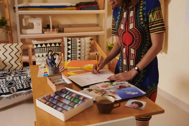 A woman drawing pattern for fabric